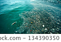 The ocean is full of floating trash and plastic waste. View from above. Concept of catastrophic water pollution 134390350