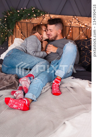 Intimate Moment With Cozy Comfort, Casual Couple Resting Together With Cheerful Socks And Charming Rustic Decor Intimate Moment With Cozy Comfort, Casual Couple Resting Together With Cheerful Socks And Charming Rustic Decor 134390418