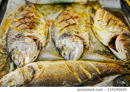 Close-Up of Baked Dorado Fish on Tray 134390695