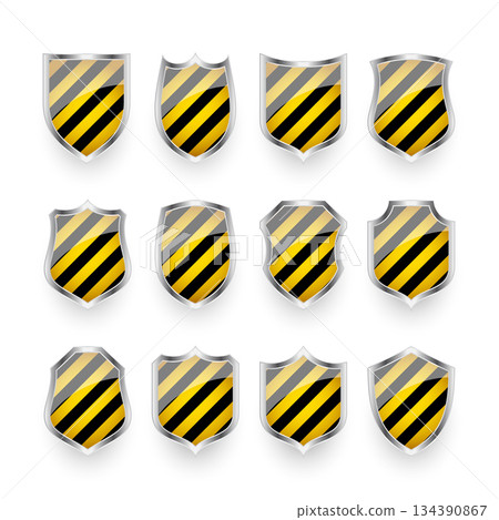 Glossy shields with yellow and black pattern. Security and protection concept. Cyber safety icons, internet privacy, web defense, digital data protection and antivirus themes. Vector illustration 134390867