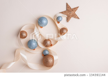 Minimalist Christmas Tree Made of Ribbon and Ornaments on Light Background 134391144