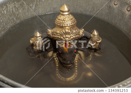 Ganesha idol immersion in water, Ganesh Chaturthi ritual 134391253