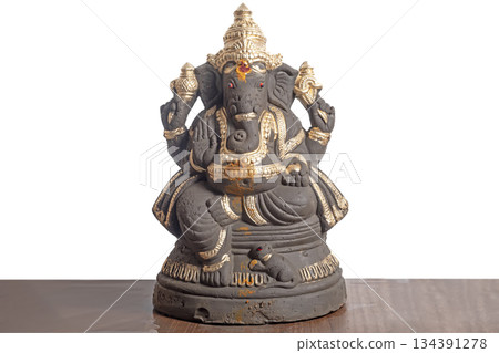 Clay Ganesha idol decorated in gold for Ganesha Chaturthi 134391278