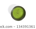 Top view of a bright green chutney In a metal cup on white background 134391361