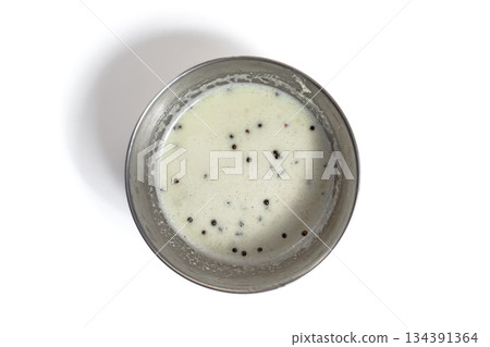 South Indian coconut chutney in a stainless steel bowl on a white background 134391364