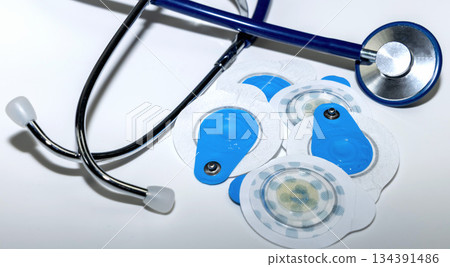 Cardiology healthcare concept with ecg electrodes and stethoscope. Cardiology healthcare concept with ecg electrodes and stethoscope. 134391486