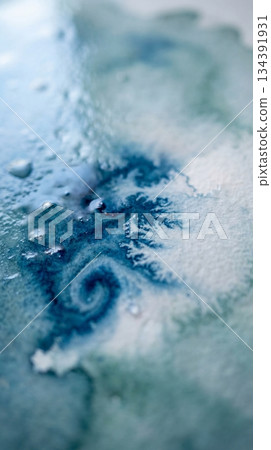 Abstract blue watercolor texture on paper 134391931