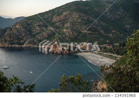 Aerial view town ruins Genoese tower of Porto Corsica France medieval watchtower Mediterranean Sea Calanches de Piana 134391968