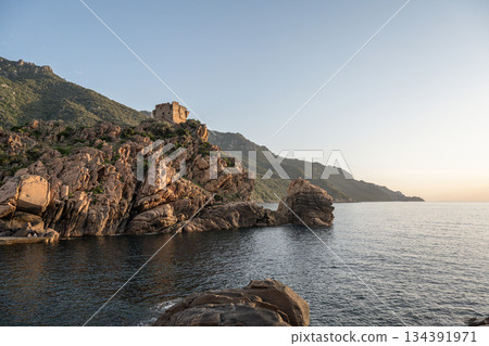 Aerial view town ruins Genoese tower of Porto Corsica France medieval watchtower Mediterranean Sea Calanches de Piana Aerial view town ruins Genoese tower of Porto Corsica France medieval watchtower Mediterranean Sea Calanches de Piana 134391971