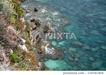 Aerial view marina cape Bonifacio south Corsica France citadel on rocky promontory on wild white limestone cliffs 134391984
