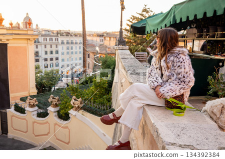 Woman enjoying festive city view near the Spanish Steps in Rome 134392384