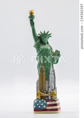 Statue of Liberty miniature figurine souvenir with green patina closeup. 134392397