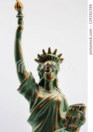 Statue of Liberty miniature figurine souvenir with green patina closeup. Statue of Liberty miniature figurine souvenir with green patina closeup. 134392398