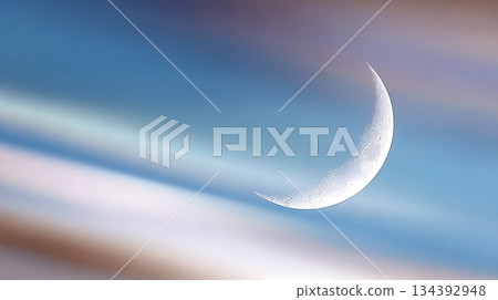 Crescent Moon With Rainbow Aura in the Night Sky Over a Serene Landscape During Twilight Hours Crescent Moon With Rainbow Aura in the Night Sky Over a Serene Landscape During Twilight Hours 134392948