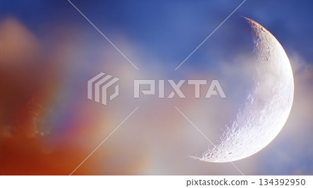 Crescent Moon With Rainbow Aura in the Night Sky Above the Horizon at Dusk Crescent Moon With Rainbow Aura in the Night Sky Above the Horizon at Dusk 134392950