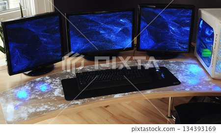 Creative Gaming Desk Setup With Multiple Monitors and a Sleek Design in a Cozy Room 134393169