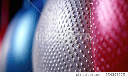 Close up of Textured Surface on Colorful Punching Bags in a Gym Setting Close up of Textured Surface on Colorful Punching Bags in a Gym Setting 134393225