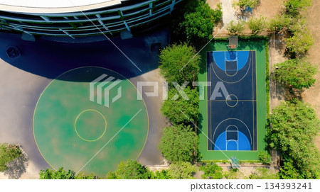 Empty Playground and Basketball Court Show Signs of Neglect in Abandoned Urban Area 134393241