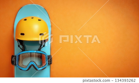 Snowboard Helmet and Goggles Rest on a Colorful Board Against a Bright Background 134393262
