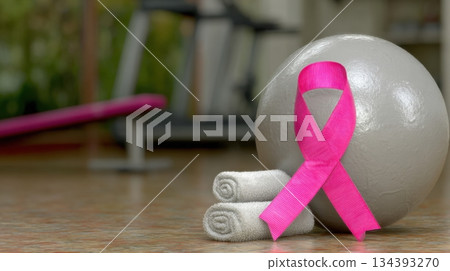 Fitness Equipment With Pink Ribbon and Towels Promoting Awareness in a Gym Setting Fitness Equipment With Pink Ribbon and Towels Promoting Awareness in a Gym Setting 134393270