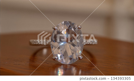 Beautiful White Sapphire Ring Displayed on Wooden Surface With Soft Lighting Highlights Beautiful White Sapphire Ring Displayed on Wooden Surface With Soft Lighting Highlights 134393305