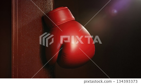 Boxing Glove Silhouette Hangs Against a Plain Wall in a Training Space 134393373