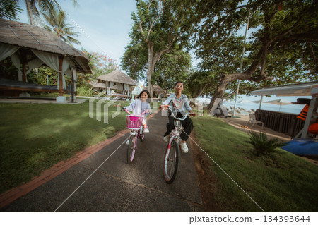 Experiencing Joyful Moments While Riding Bikes on a Beautiful Sunny Day 134393644