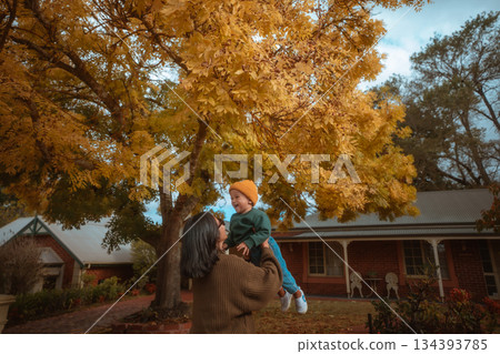 Autumn Joy A Loving Mother and Her Child Embrace Amidst the Golden Leaves Autumn Joy A Loving Mother and Her Child Embrace Amidst the Golden Leaves 134393785