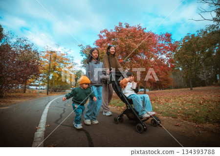 A Fun Family Day Out Enjoying an Autumn Stroll in the Local Park A Fun Family Day Out Enjoying an Autumn Stroll in the Local Park 134393788