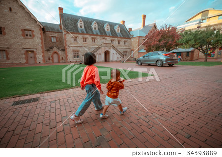 Children Joyfully Walking Around the Beautiful Historic Streets with Energy and Curiosity Children Joyfully Walking Around the Beautiful Historic Streets with Energy and Curiosity 134393889