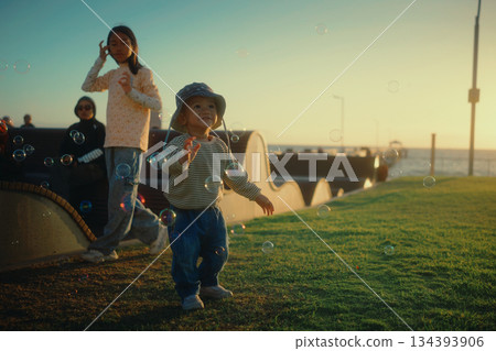 Joyful Moments Children Engaging in Play Outdoors During Sunset Hours Joyful Moments Children Engaging in Play Outdoors During Sunset Hours 134393906