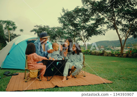 An Exciting Family Camping Adventure in Nature with Kids Using a Tent for Fun and Connection 134393907