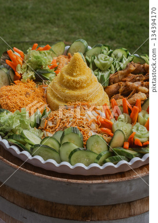 A Colorful and Vibrant Platter Filled with Fresh Vegetables and Gourmet Delicacies A Colorful and Vibrant Platter Filled with Fresh Vegetables and Gourmet Delicacies 134394170