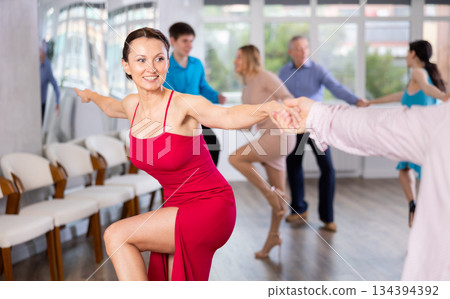 Adult woman dancing 134394392