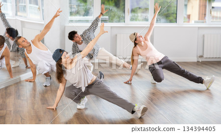 Young girl practicing breakdance floor-works in training hall 134394405