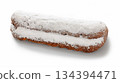 Stollen with filling of raisins, candied fruit 134394471