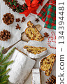 Stollen with filling of raisins, candied fruit 134394481