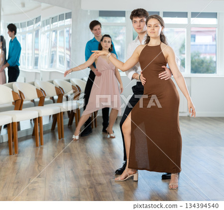 Incendiary swing dance performed by young people in dance studio 134394540