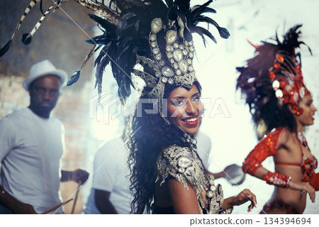 Festival portrait, carnival dancer and woman smile with music and party celebration in Brazil. Mardi gras, dancing and culture event costume with young female person with happiness from performance Festival portrait, carnival dancer and woman smile with music and party celebration in Brazil. Mardi gras, dancing and culture event costume with young female person with happiness from performance 134394694
