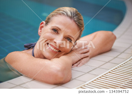 Swimming pool, happy and portrait of woman relax on holiday, summer vacation and weekend getaway. Travel, luxury spa resort and female person smile in water for happiness, wellness and peace outdoors Swimming pool, happy and portrait of woman relax on holiday, summer vacation and weekend getaway. Travel, luxury spa resort and female person smile in water for happiness, wellness and peace outdoors 134394752