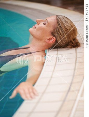 Swimming pool, calm and woman relax on holiday, summer vacation and weekend getaway. Travel, luxury spa hotel and happy female person relaxing in water for happiness, wellness and peace outdoors Swimming pool, calm and woman relax on holiday, summer vacation and weekend getaway. Travel, luxury spa hotel and happy female person relaxing in water for happiness, wellness and peace outdoors 134394753