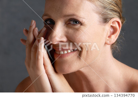 Portrait, skincare and senior woman with beauty, dermatology and wellness against studio background. Face, mature female or old lady with confidence, detox and makeup with smooth, clear and soft skin Portrait, skincare and senior woman with beauty, dermatology and wellness against studio background. Face, mature female or old lady with confidence, detox and makeup with smooth, clear and soft skin 134394770