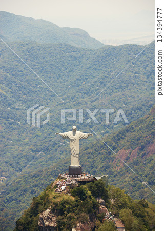 Travel, monument and Christ the Redeemer in Rio on hill for tourism, sightseeing and global destination. Traveling, architecture and drone view of statue, sculpture and Brazil landmark on mountain Travel, monument and Christ the Redeemer in Rio on hill for tourism, sightseeing and global destination. Traveling, architecture and drone view of statue, sculpture and Brazil landmark on mountain 134394777
