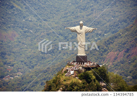 Landscape, monument and Christ the Redeemer statue for tourism, sightseeing and travel destination. Traveling, Rio de Janeiro and aerial view of architecture, sculpture or landmark on Brazil mountain 134394785