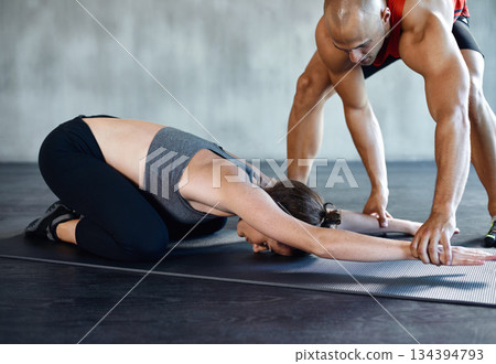 Gym, coach and people on floor stretching for health fitness performance, workout commitment or team training exercise. Pilates personal trainer, coaching and man support person with body warm up Gym, coach and people on floor stretching for health fitness performance, workout commitment or team training exercise. Pilates personal trainer, coaching and man support person with body warm up 134394793
