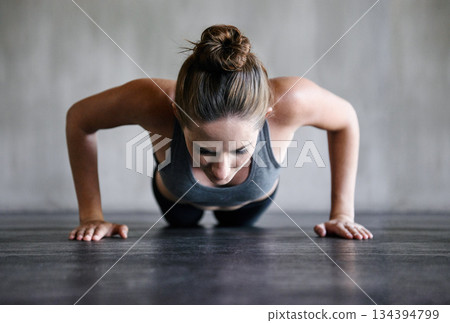 Training, push up and woman on a floor for fitness, cardio and endurance at gym. Plank, exercise and female athlete at a health center for core, strength and ground workout with determined mindset Training, push up and woman on a floor for fitness, cardio and endurance at gym. Plank, exercise and female athlete at a health center for core, strength and ground workout with determined mindset 134394799