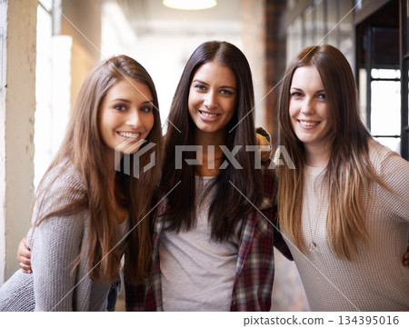 University, education and portrait of women with smile ready for studying, class and learning together. Friendship, scholarship and happy female students in school, academy and college hallway 134395016