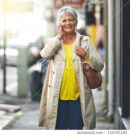 Phone call, city and portrait of senior woman on cellphone discussion, communication or chat to smartphone user. Urban travel, connectivity and elderly person talking, walking commute or consulting 134395100
