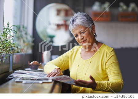 Cafe, newspaper and senior woman reading daily news, article story or morning paper in store. Coffee shop customer, headline information and relax elderly person, female client or lady in restaurant Cafe, newspaper and senior woman reading daily news, article story or morning paper in store. Coffee shop customer, headline information and relax elderly person, female client or lady in restaurant 134395105