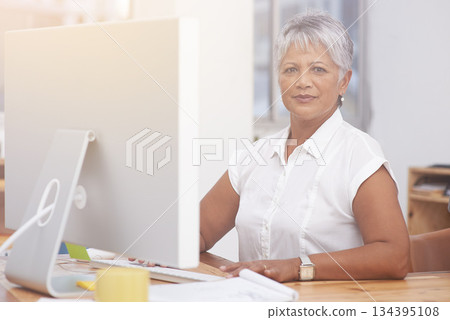 Desktop, portrait and mature woman in office for online management, digital planning and working with career mindset. Confident indian person, professional worker or business employee on computer pc Desktop, portrait and mature woman in office for online management, digital planning and working with career mindset. Confident indian person, professional worker or business employee on computer pc 134395108